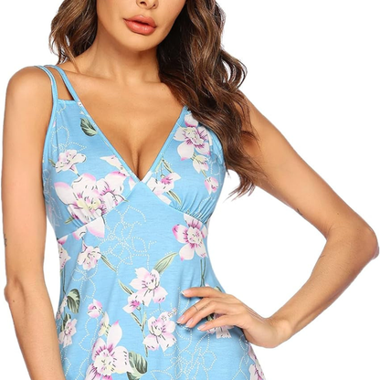 Woman wearing a blue floral dress on a white background