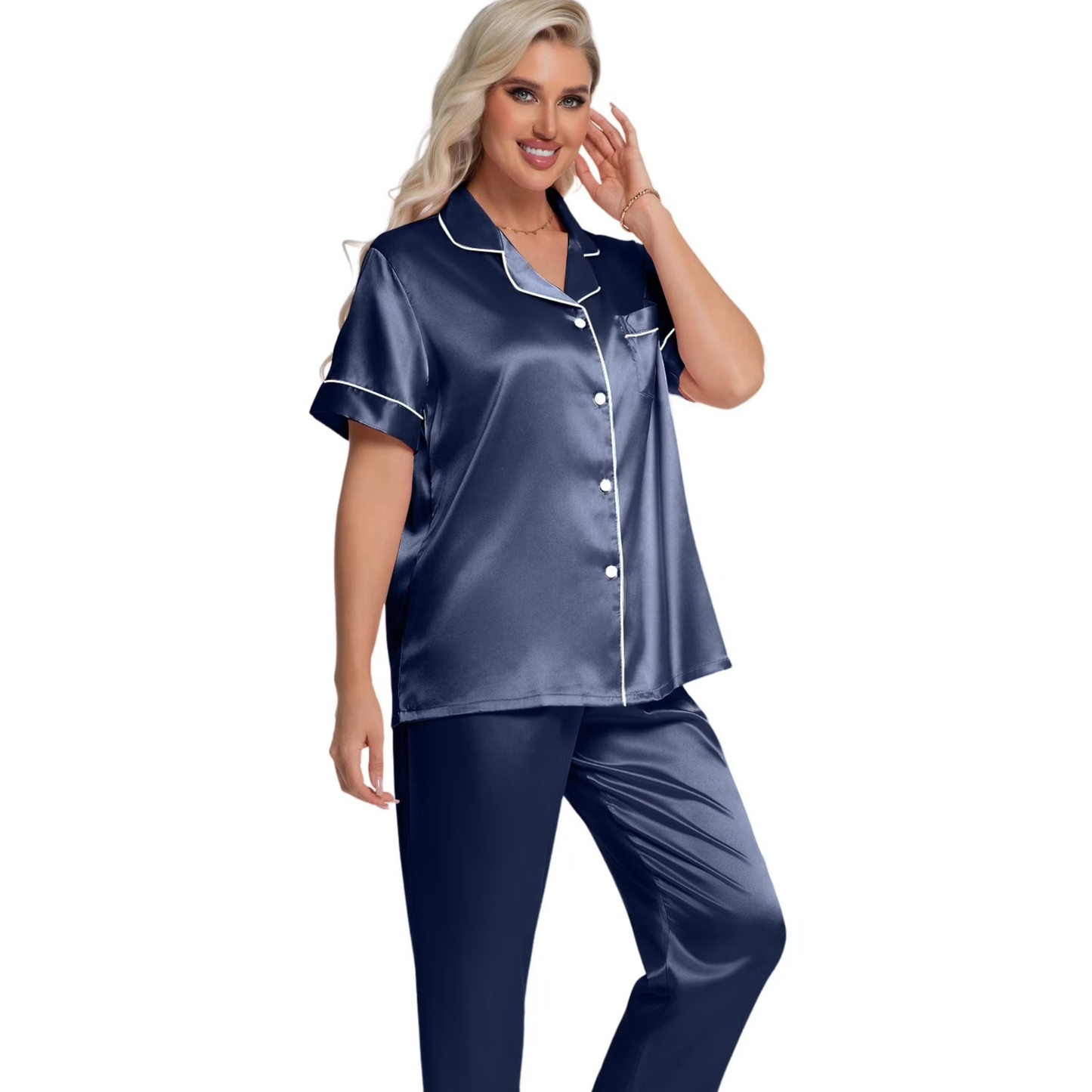 Woman wearing a navy satin pajama set on a white background