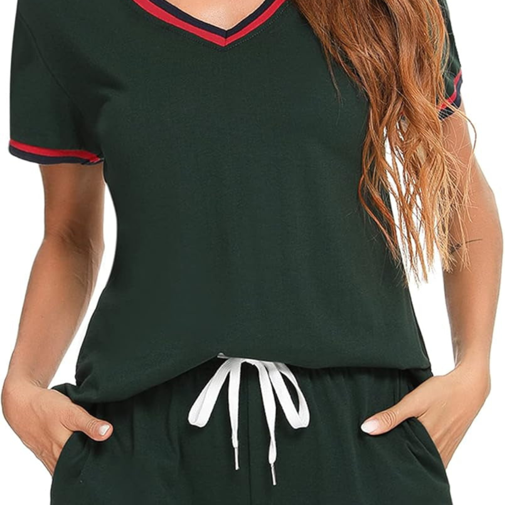 Green outfit with red and white trim on a plain background