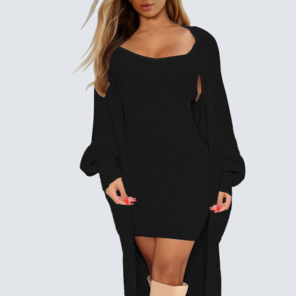 Black long-sleeve dress worn by a model on a light gray background