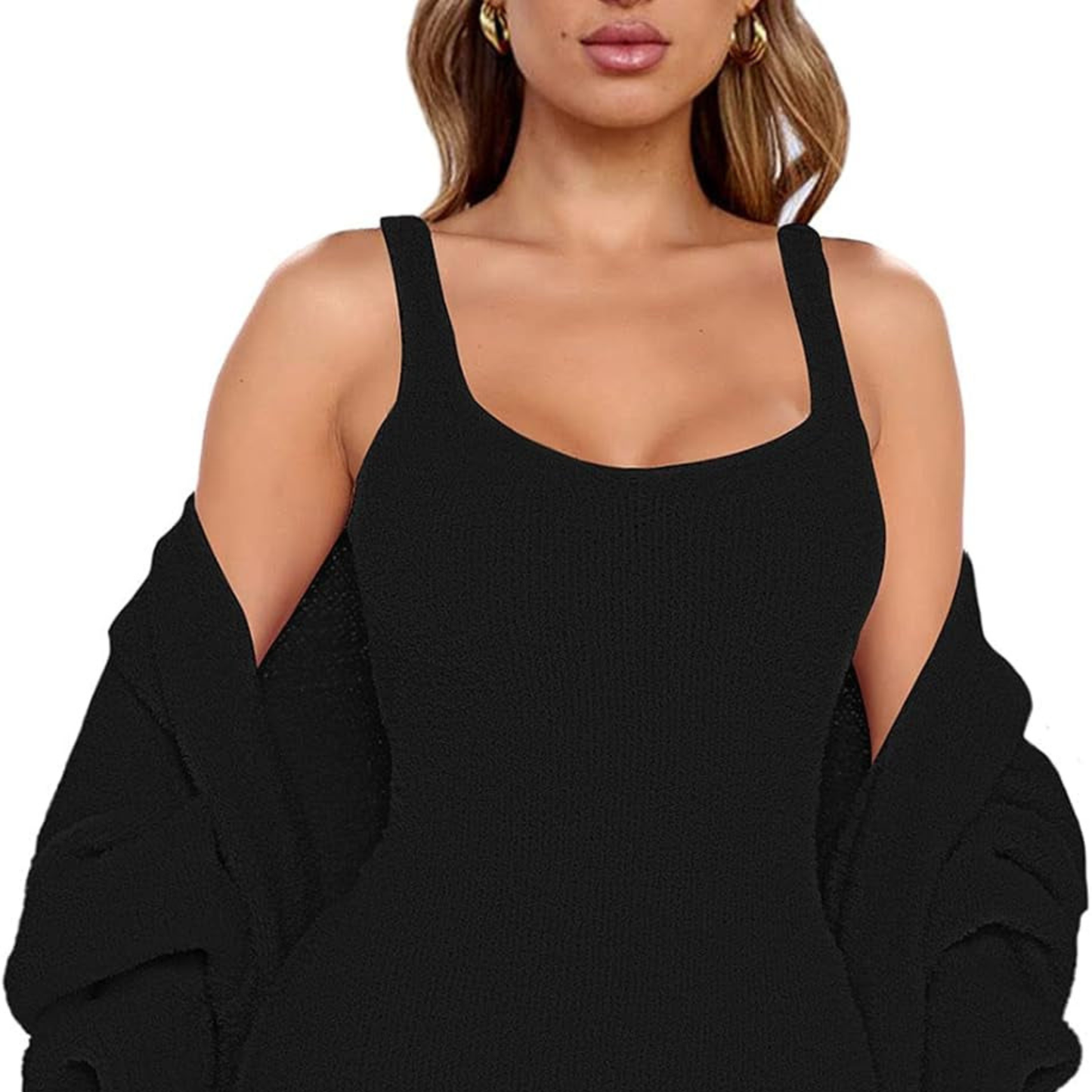 Person wearing a black sleeveless top with a blurred background