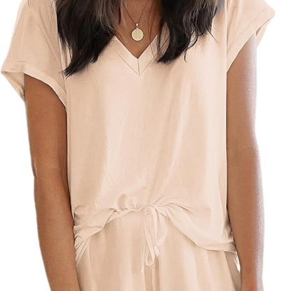 Beige dress worn by a person on a white background