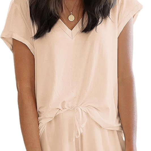 Beige dress worn by a person on a white background