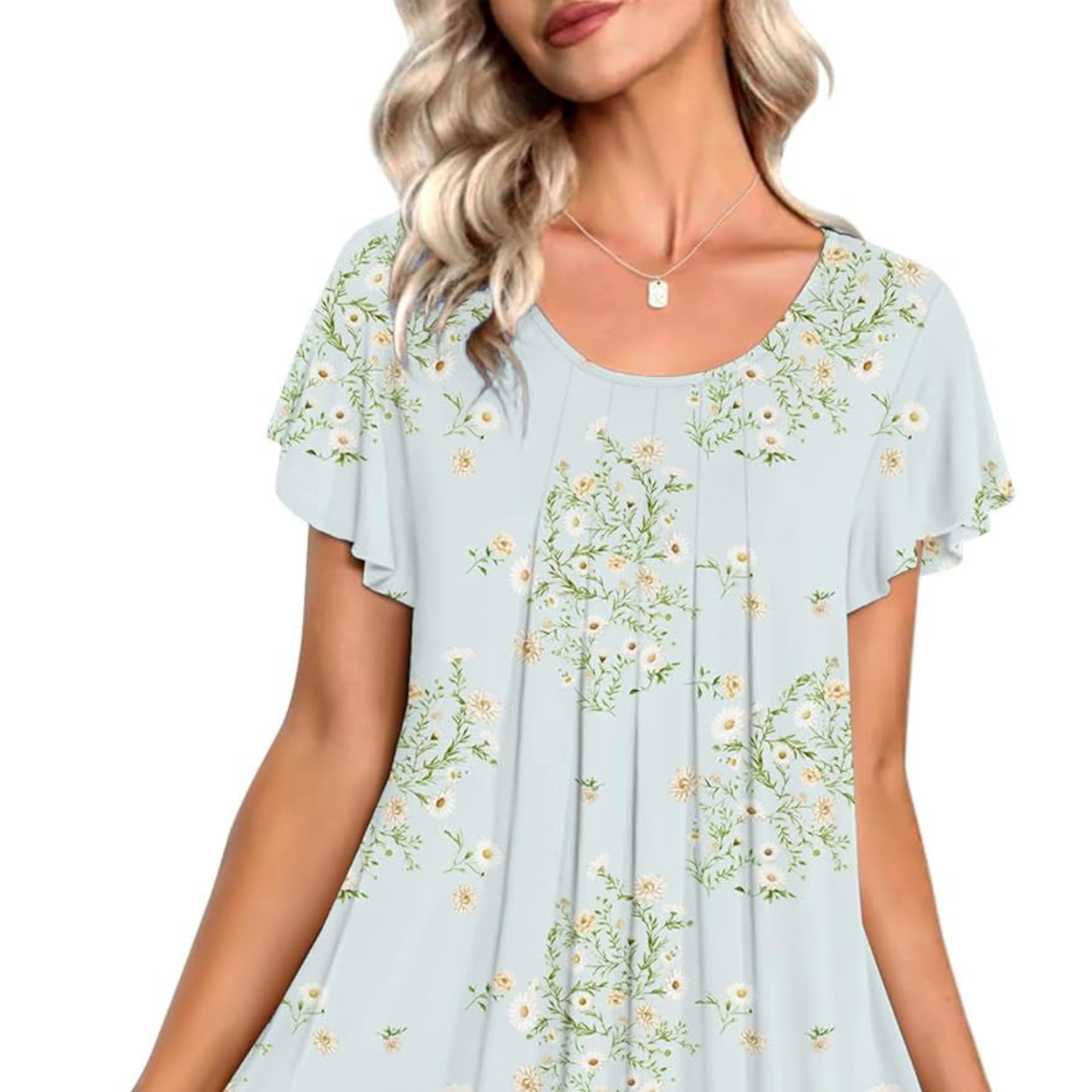 Light blue blouse with floral pattern worn by a model on a white background