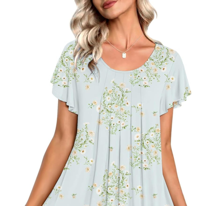 Light blue blouse with floral pattern worn by a model on a white background
